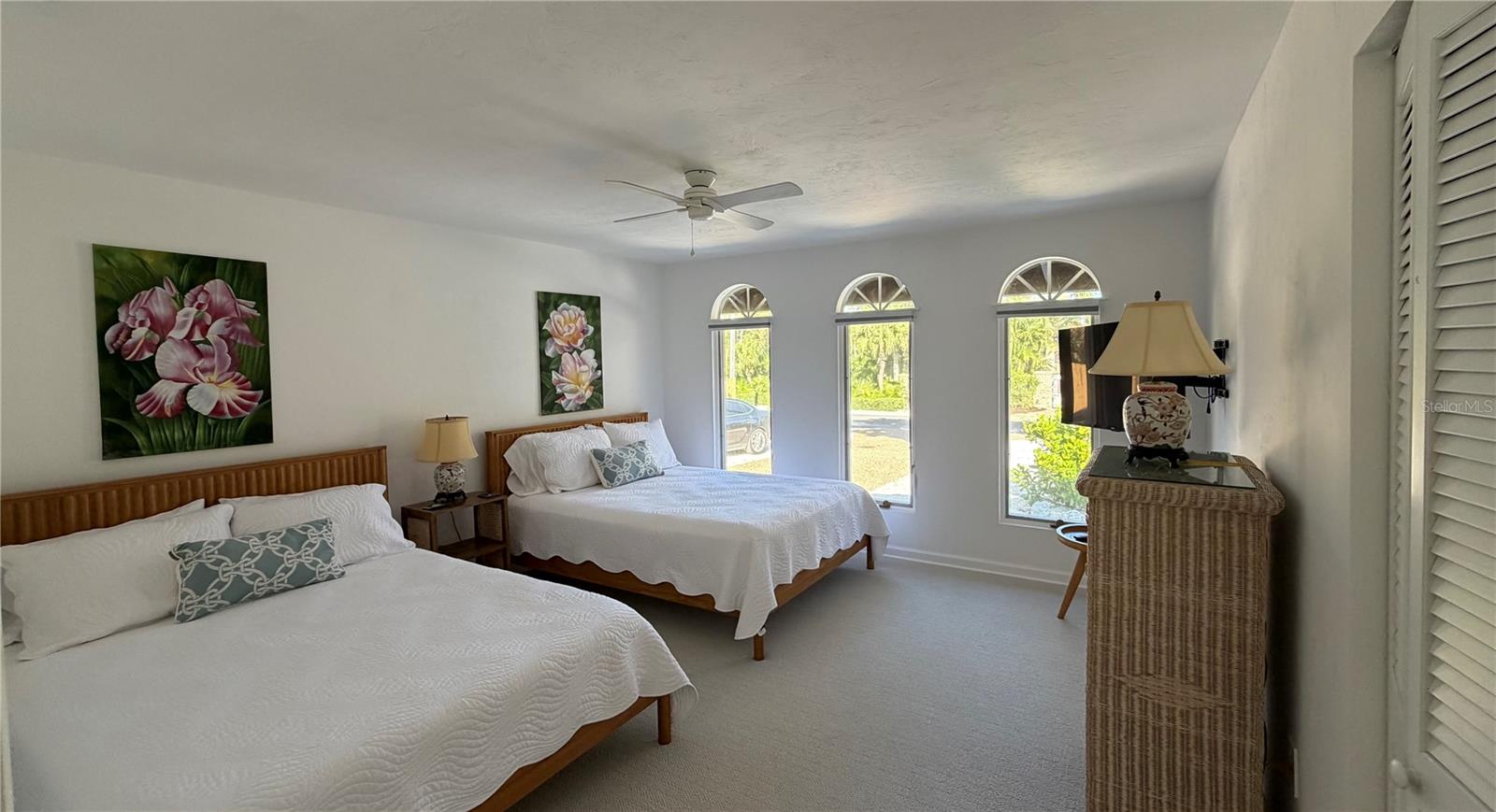 Bay-side bedroom has 2 queen beds.