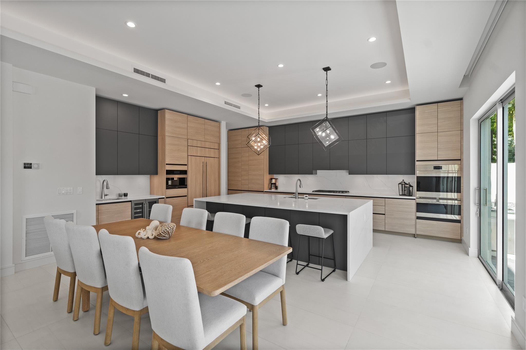 A custom designer kitchen with top of the line appliances, huge island, and tons of cabinetry storage. A remarkable luxury townhome rental that redefi