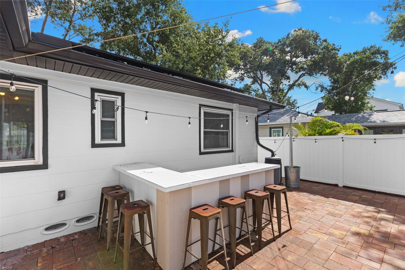 Backyard with Pavers and Vinyl Fence