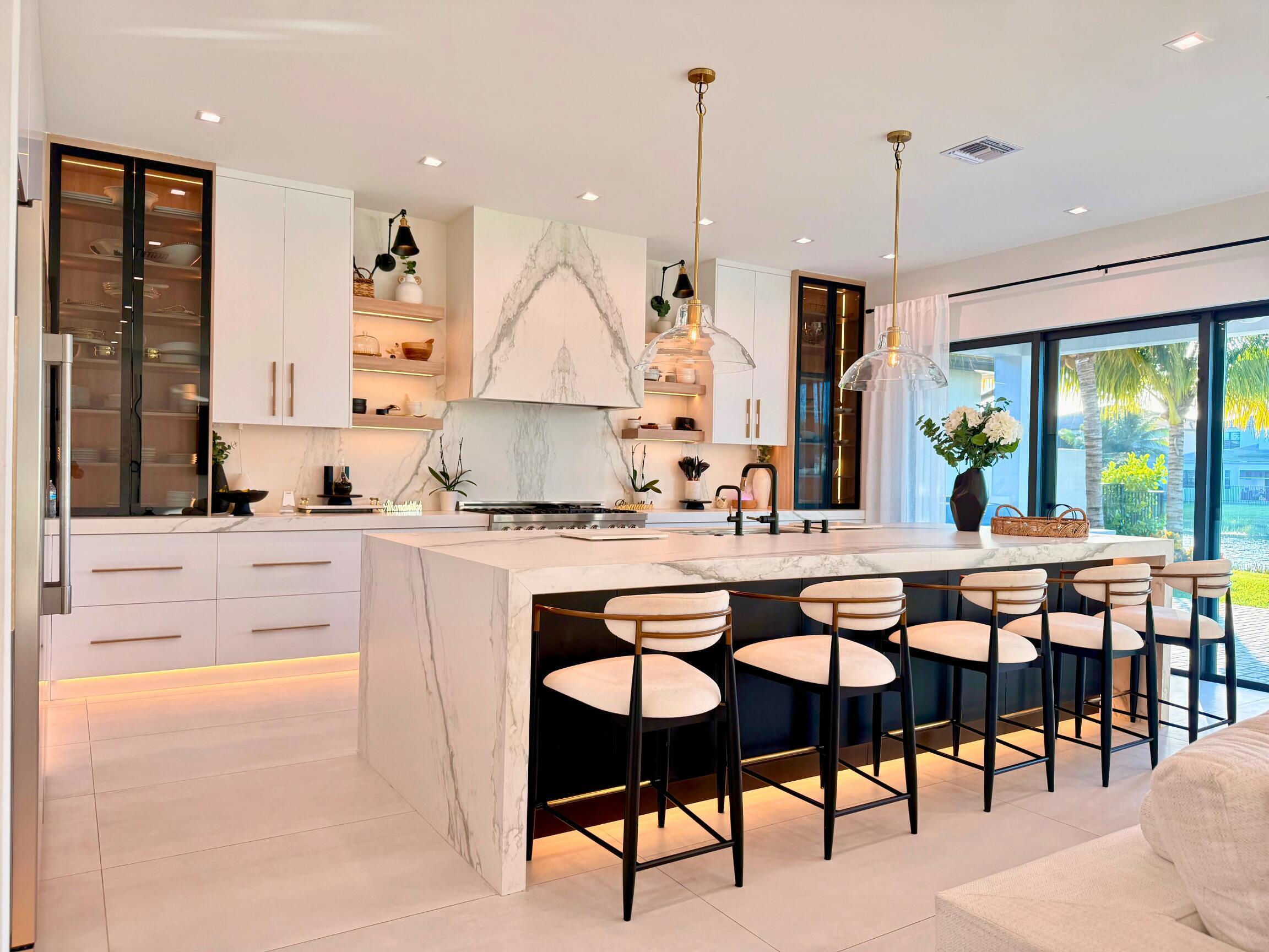 This premium kitchen, was completely removed then recreated with Italian porcelain and Designer appliances. It also has storage and way to many out ou