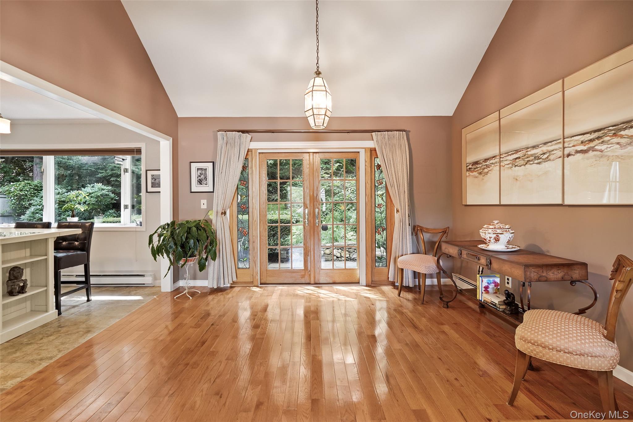 Dining area opens to kitchen and French doors to patio
