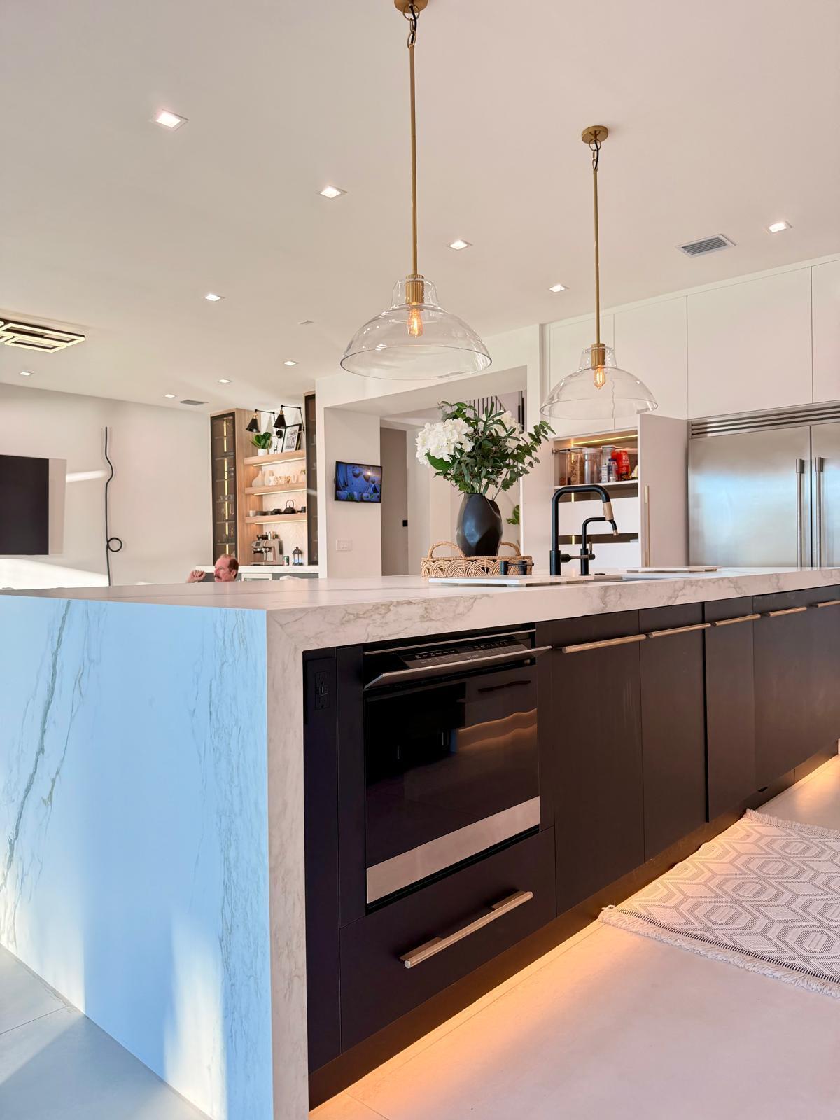 Built-in under-counter convection microwave drawer integrated into custom kitchen cabinetry, featuring convection cooking and an air fry function for