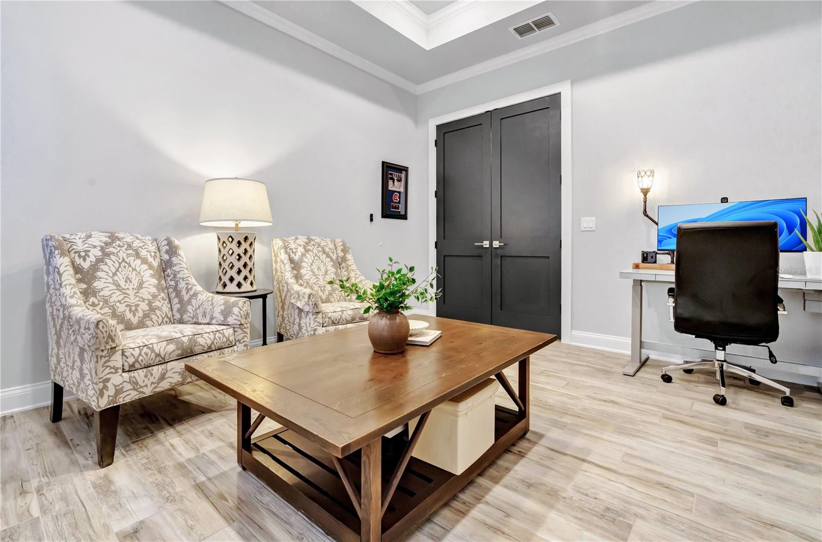 Versatile flex room ideal as a home office, den, or additional guest space.