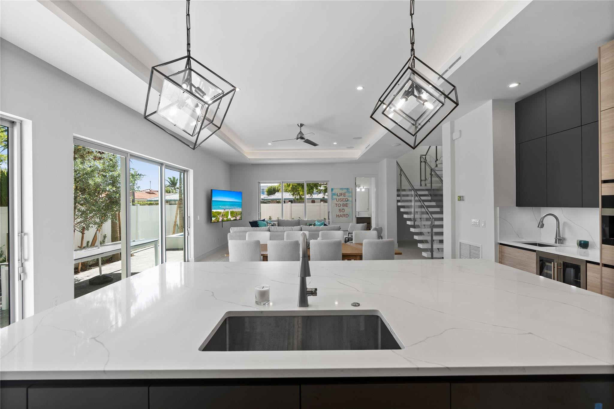 A custom designer kitchen with top of the line appliances, huge island, and tons of cabinetry storage. A remarkable luxury townhome rental that redefi