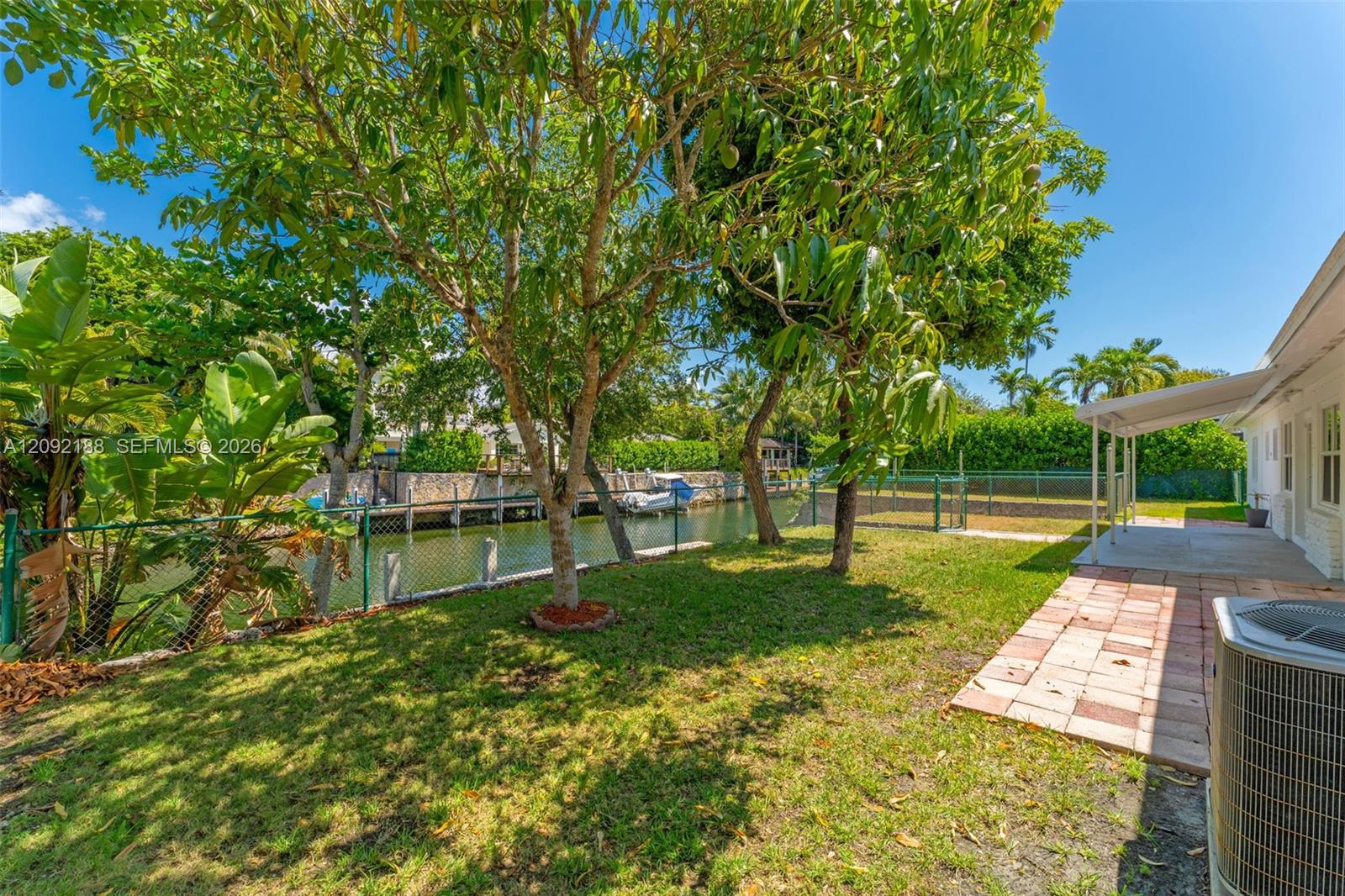 Upper tier - Mature fruit trees + covered porch