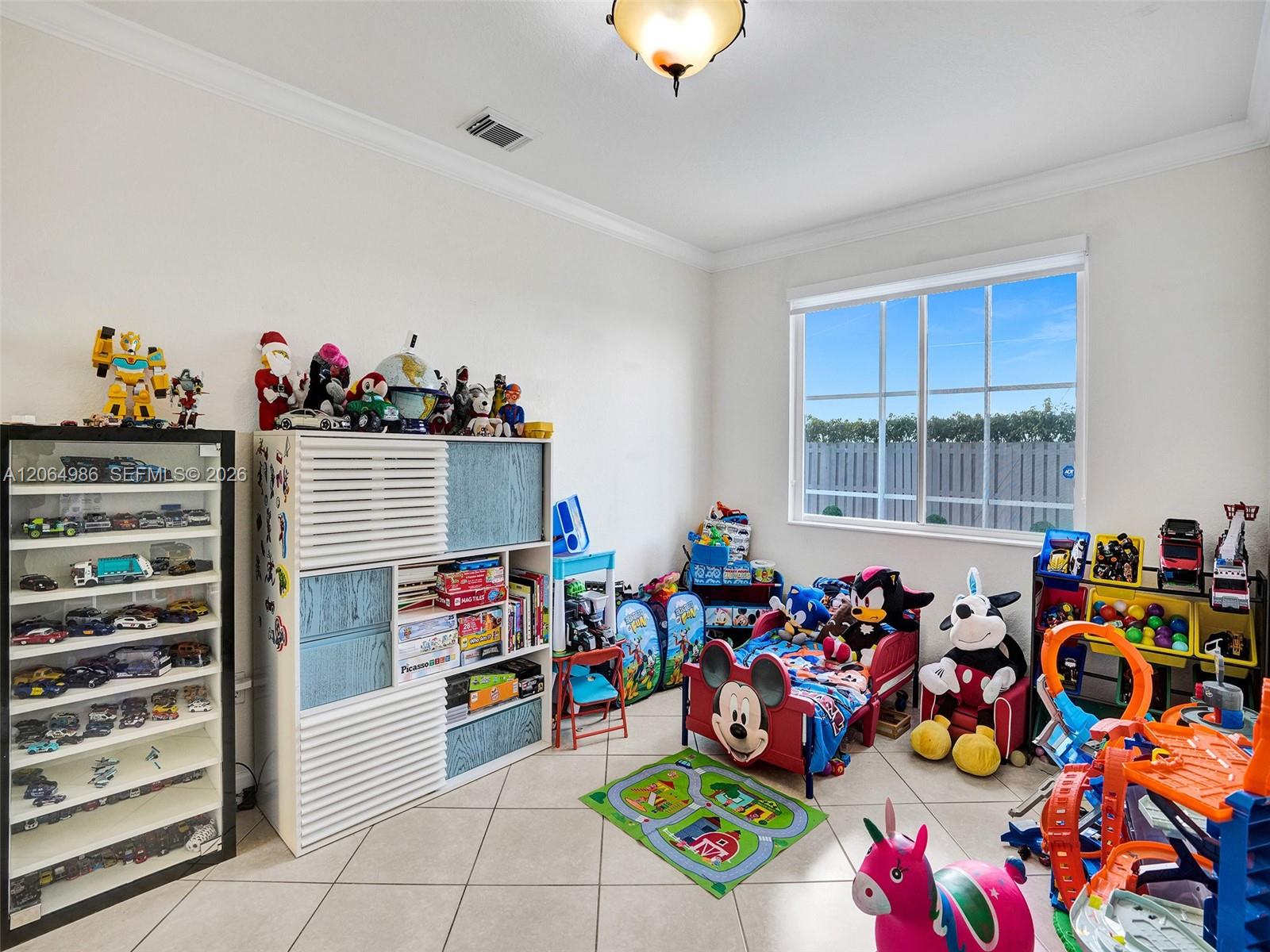 FIRST FLOOR BEDROOM WITH POOL VIEW USED AS GAME ROOM