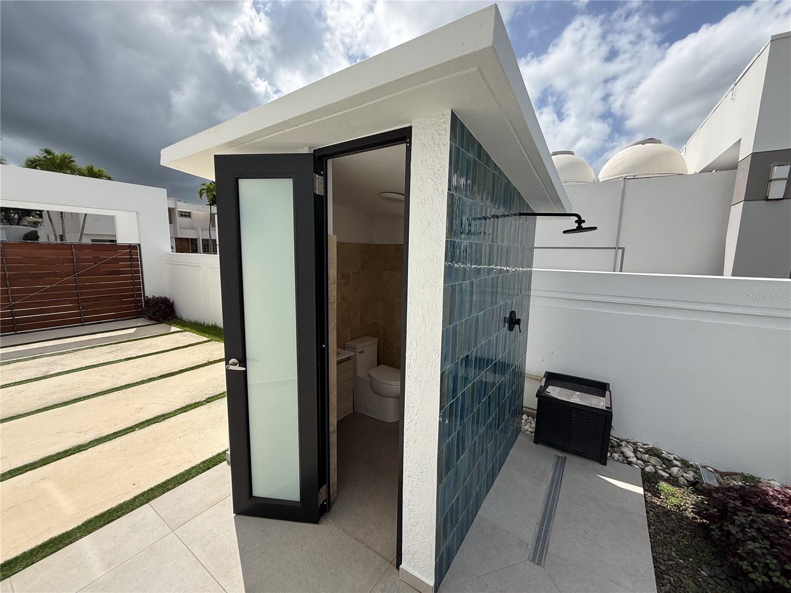 pool half bath with exterior shower