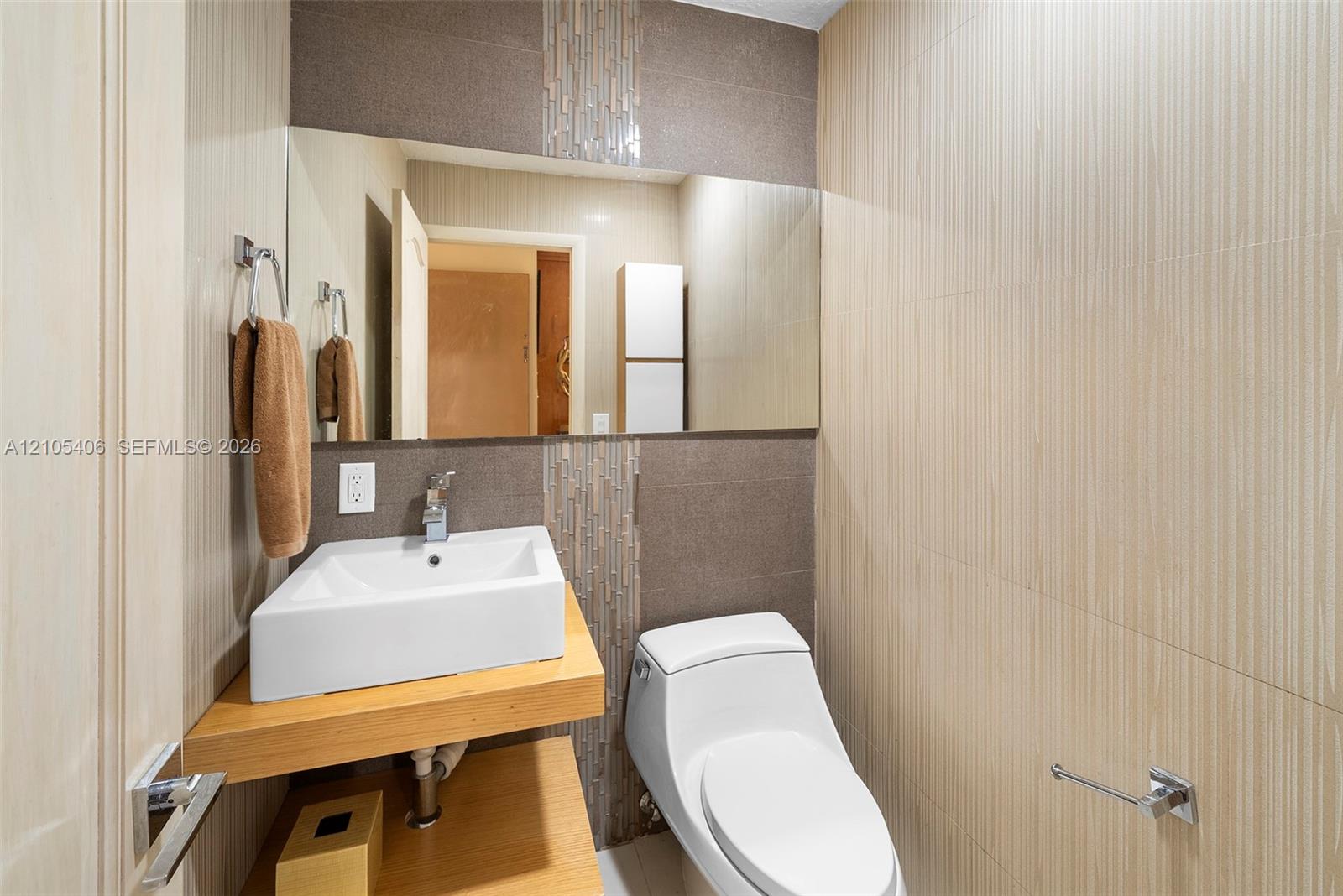 Wall-mounted vanity with a rectangular vessel sink, complete with a modern faucet