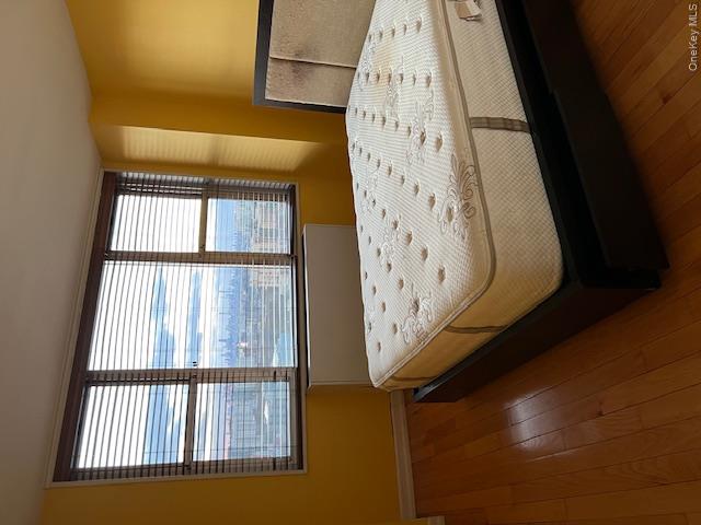 Bedroom featuring dark hardwood / wood-style floors