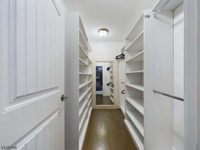 Primary bedroom walk-in closet