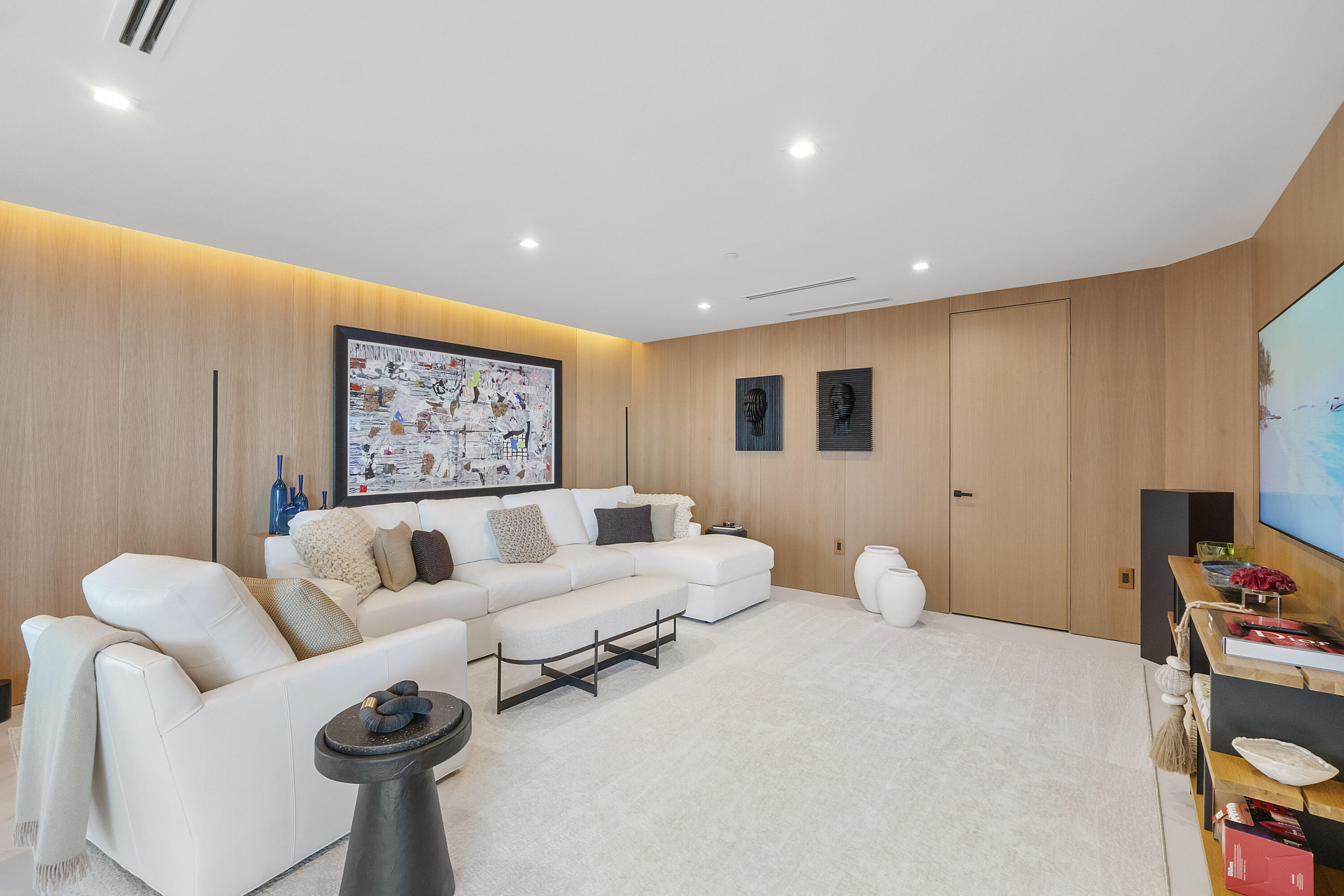 A Living Room Wrapped in White Oak — An extraordinary level of craftsmanship defines this beautifully proportioned private living room, where costly s