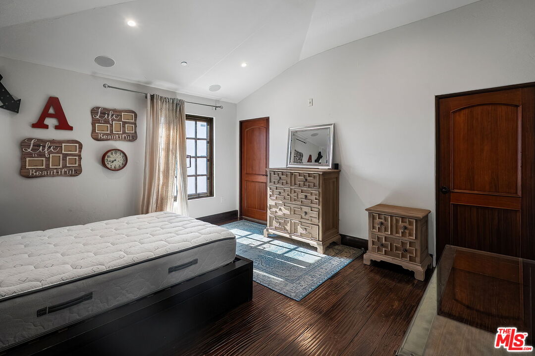 Secondary bedroom with dark wo