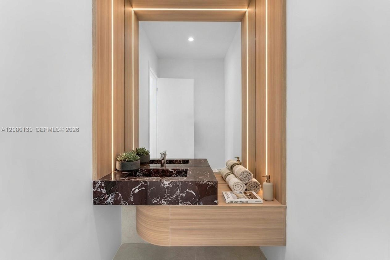 Powder Room. Disclaimer: Several photographs presented in this listing contain digitally added furniture, artwork, and decor. These virtually staged i