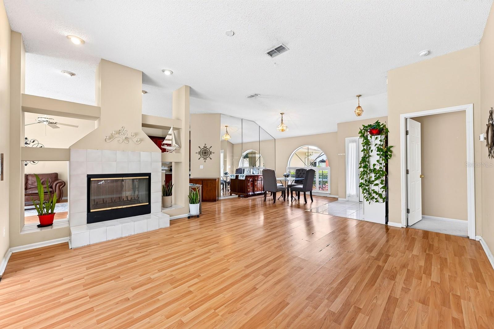 Step inside to LAMINATE WOOD FLOORING and a light, open layout designed for both everyday living and entertaining.
