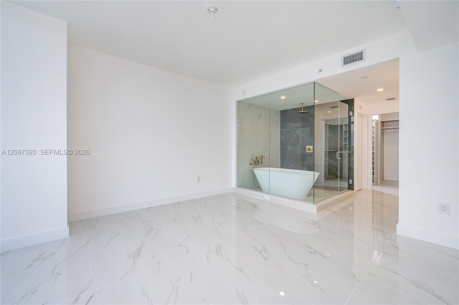 Great master bedroom. Motorized shades and blackout