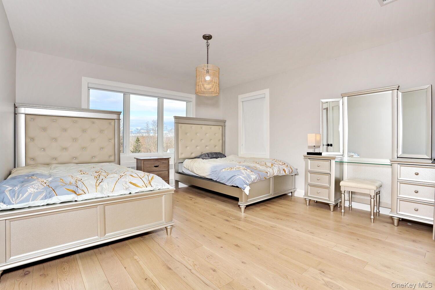 Bedroom with light wood finished floors