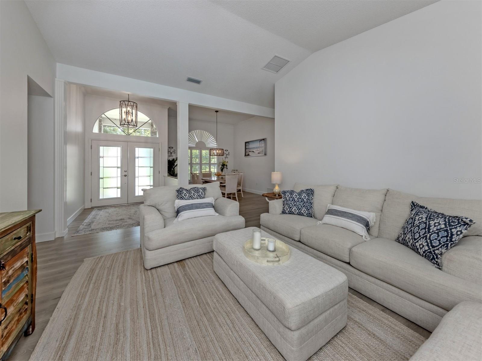 The formal living room is large and bright