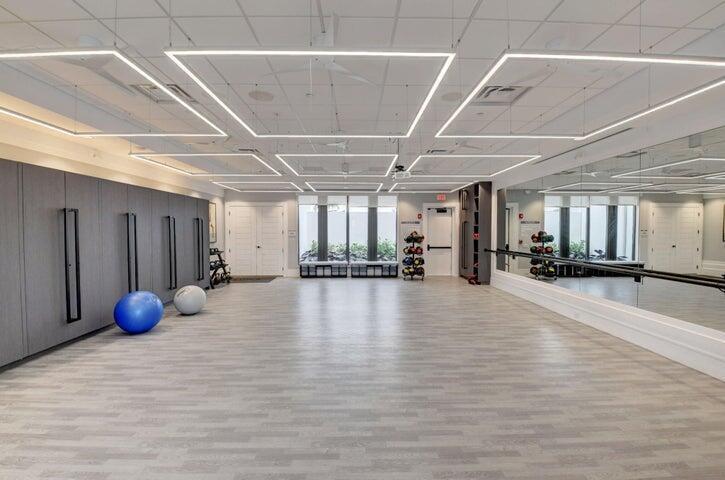 Dedicated fitness studio ideal for yoga, stretching, and group training sessions.