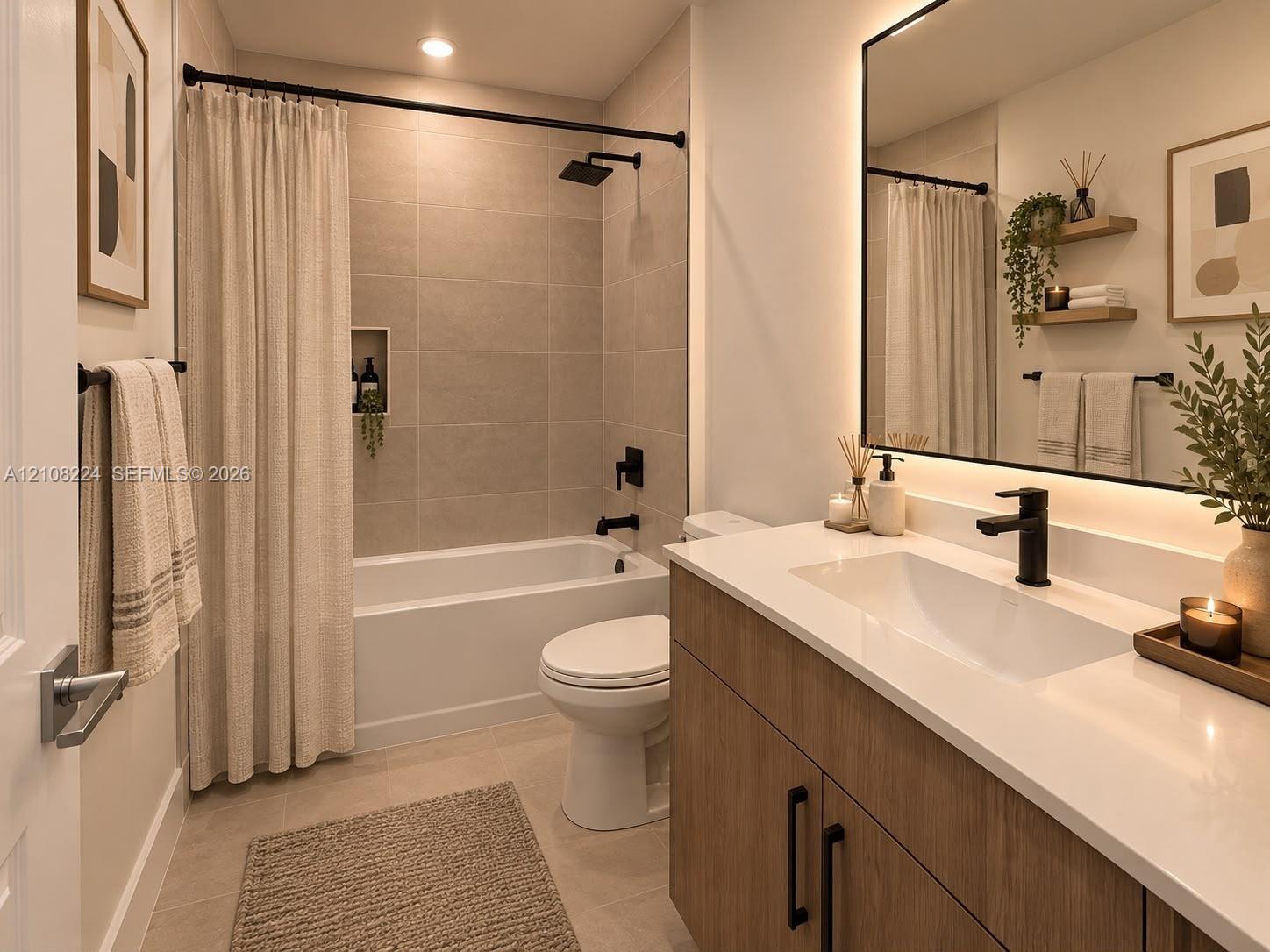 Bathroom featuring a wood-finish vanity with a quartz countertop, recessed shower niche, oversized backlit mirror, and matte black plumbing fixtures