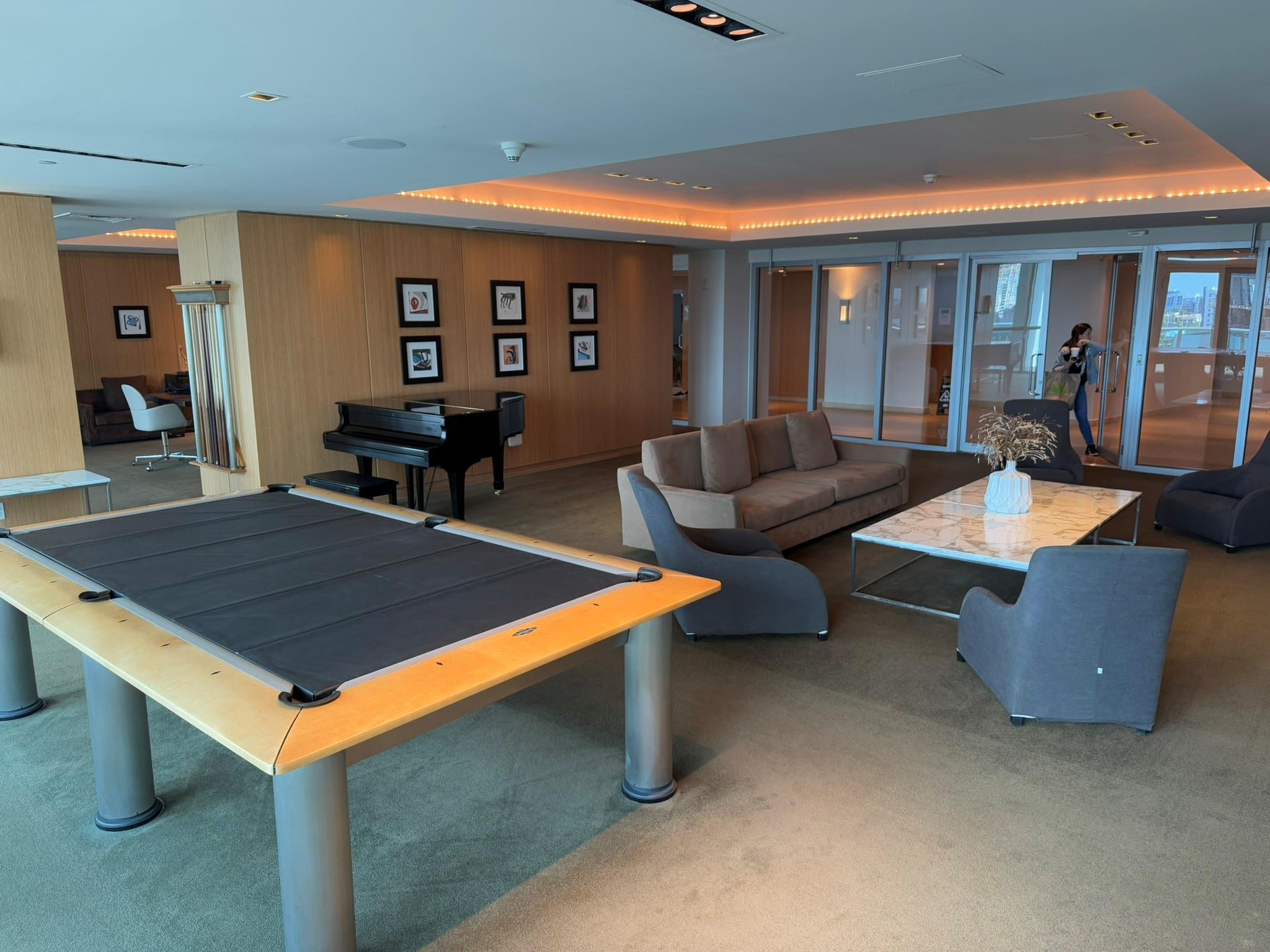 Spacious common area featuring a billiards table, grand piano, and recessed lighting