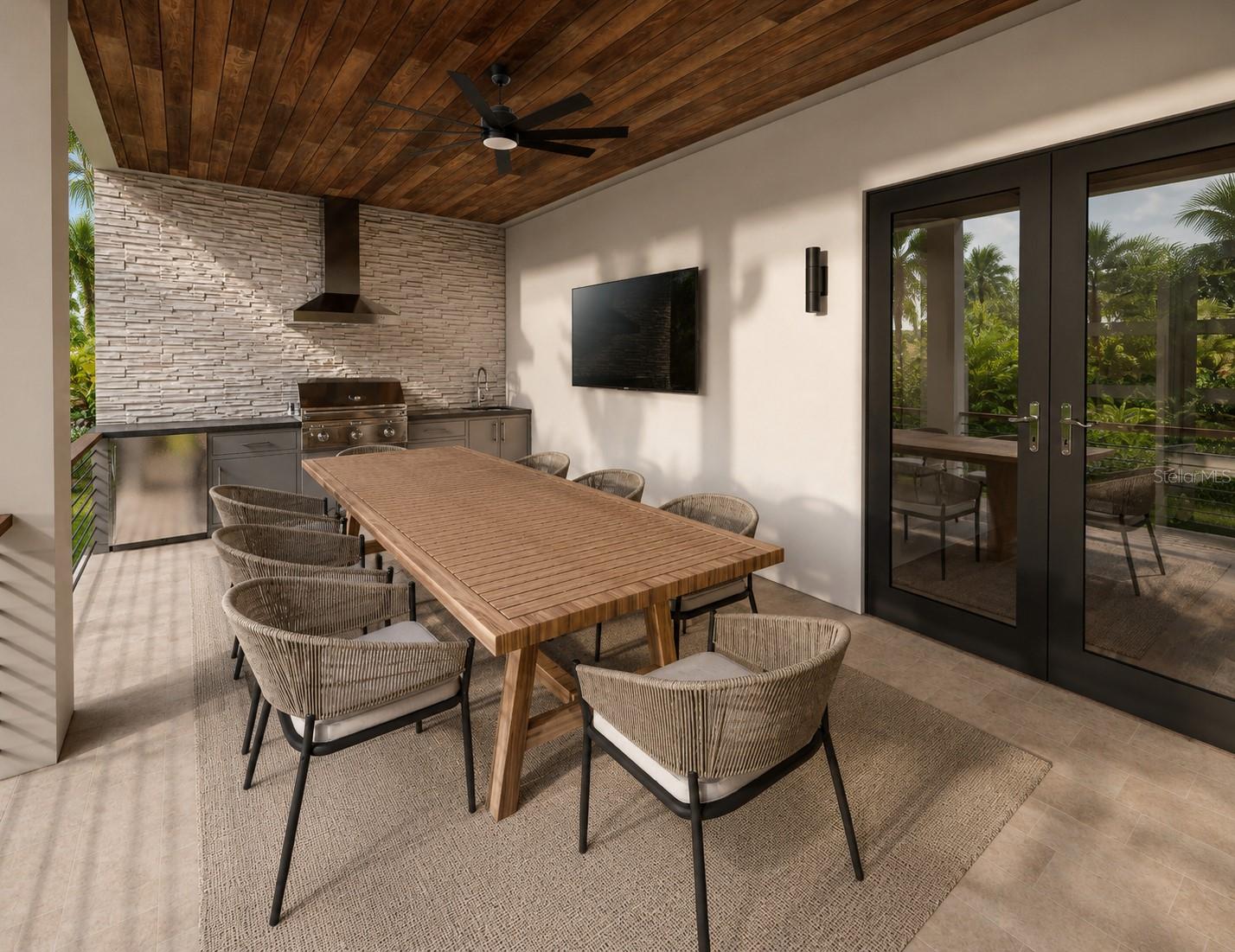 Artisan styled outdoor kitchen with tounge and groove ceiling on the lanai